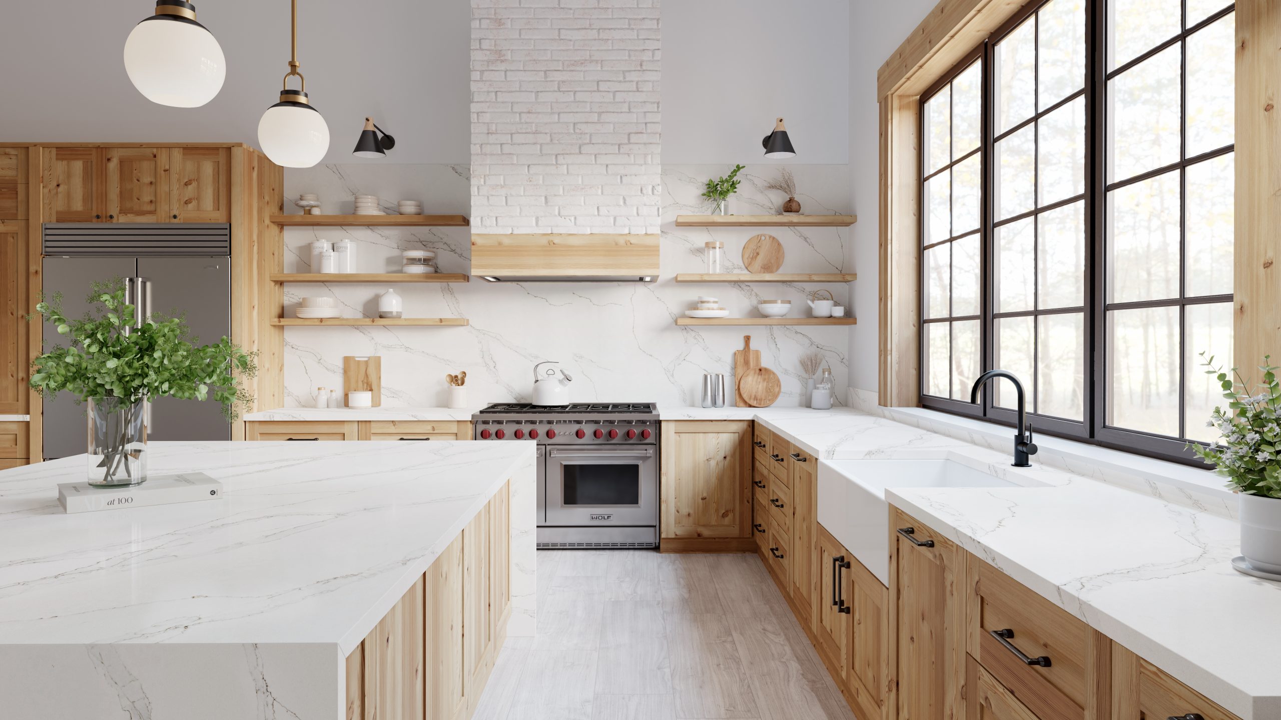 Modern cottage kitchen with Calacatta Altissmo countertops. Kitchen has natural lighting.