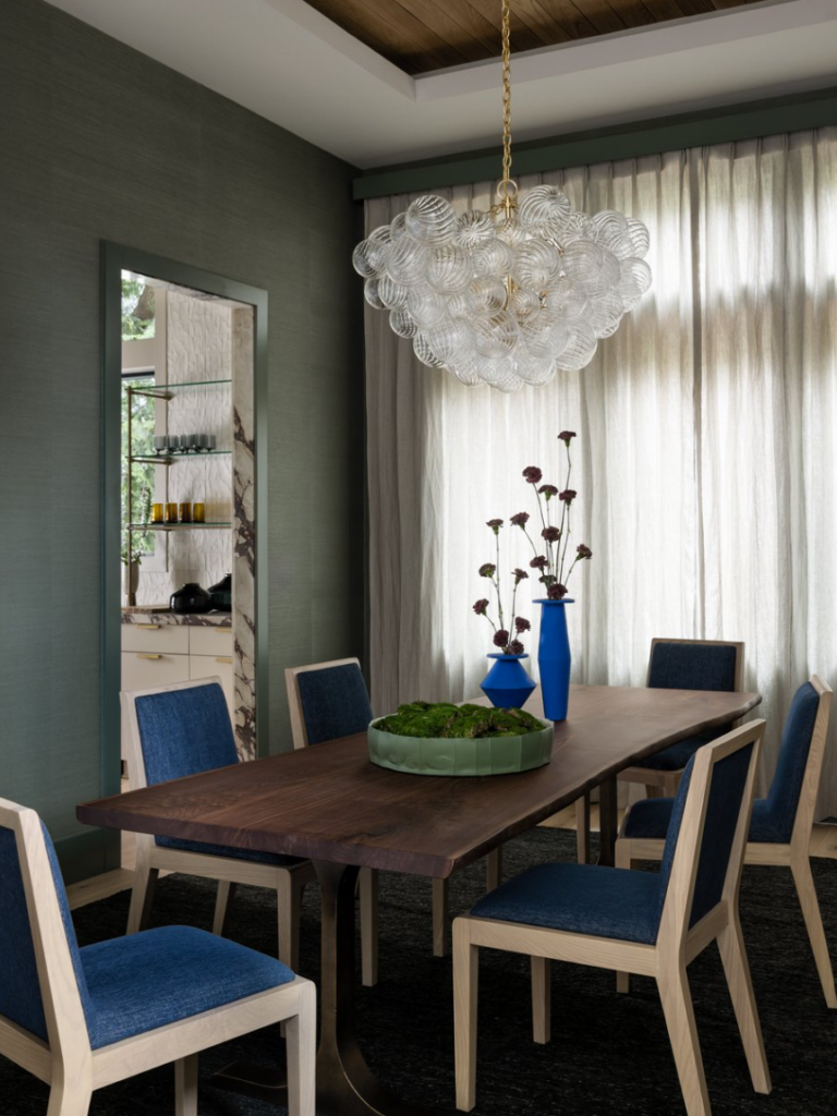 Dining room with glimpse of stone entryway 